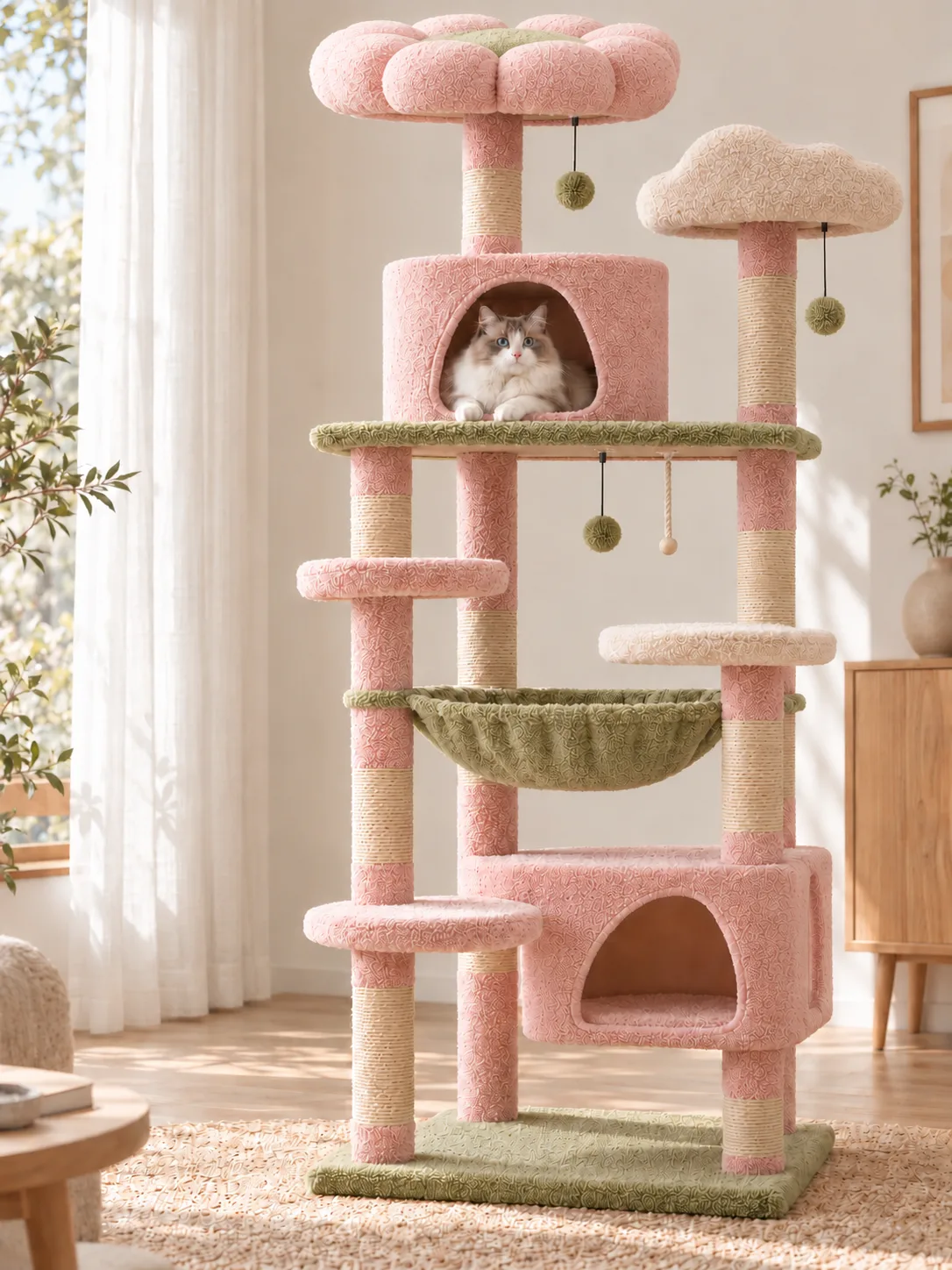 Pink-and-green tall cat tree in a living room, cat in the cylindrical house