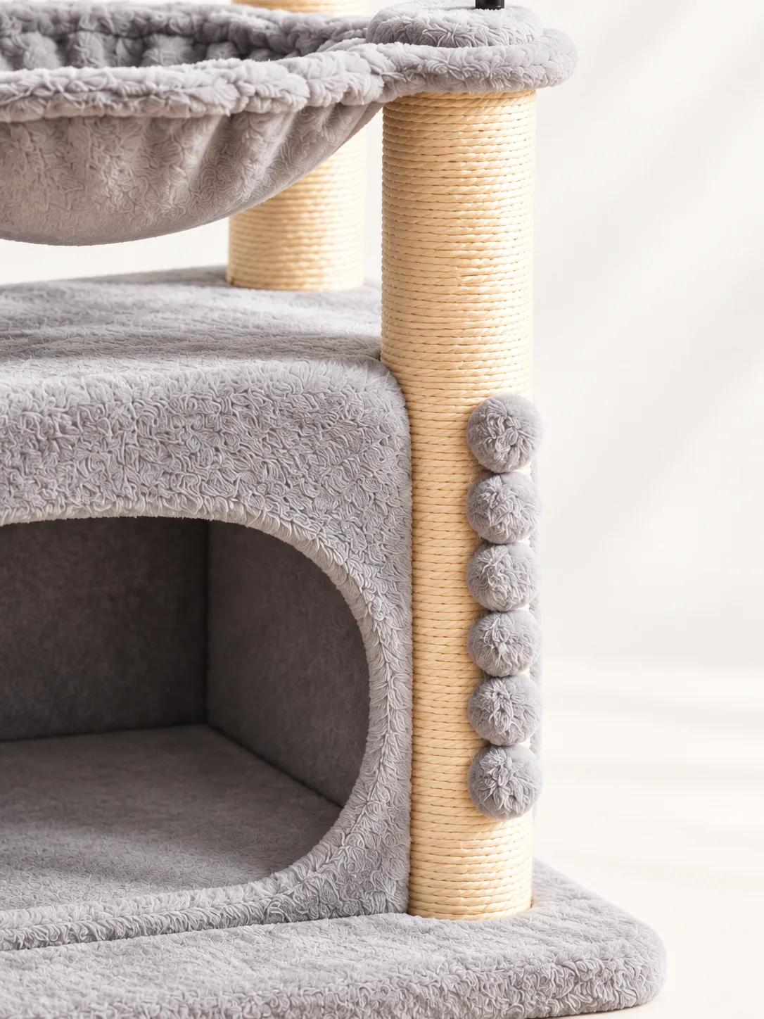 Sisal post and pom-pom detail